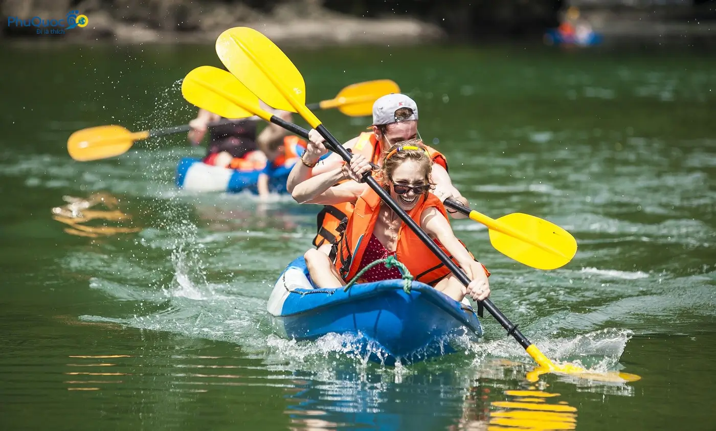 Tourists experiencing kayak rowing on Cua Can River Phu Quoc