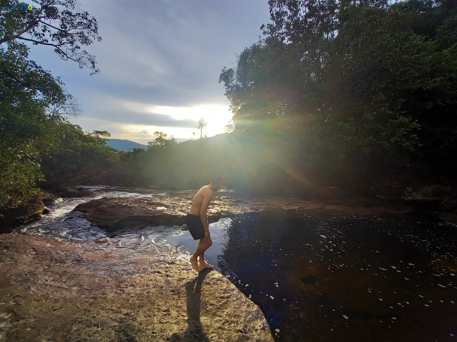 Travelers bathing at Suoi Mo Phu Quoc soaking in clear natural stream pools