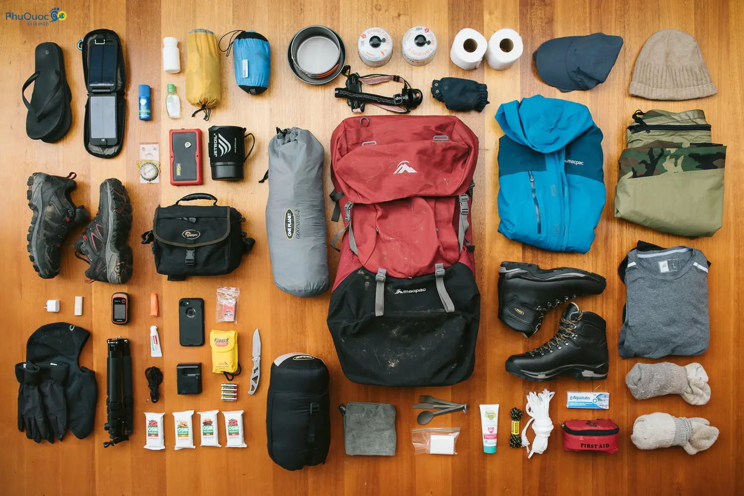 Essential Phu Quoc trekking gear including hiking shoes backpack water bottle and insect spray