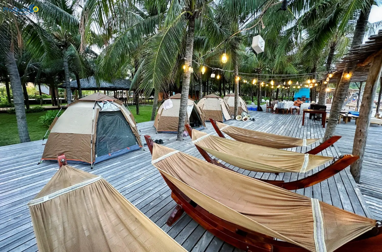 Tented campsite and hammock relaxation along Vinh Dam Phu Quoc beach at night