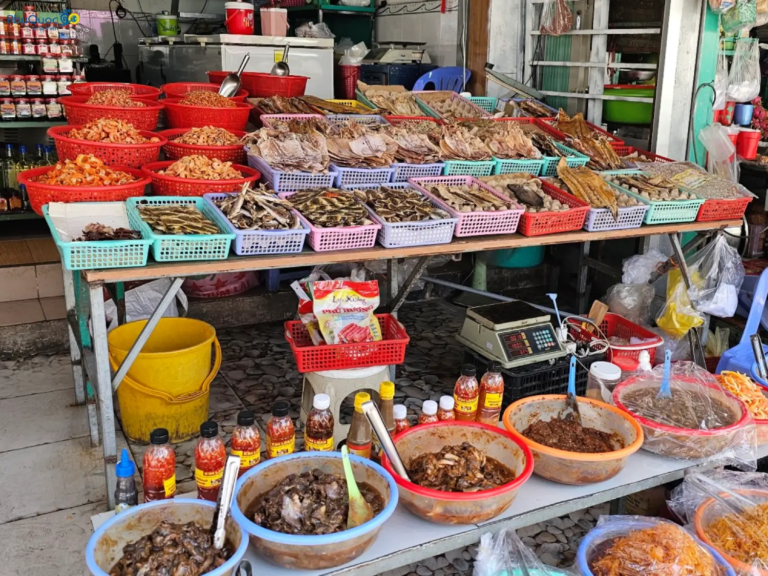 Sun-dried squid, dried shrimp, dried threadfin fish and traditional Phu Quoc fish sauce neatly displayed at a gift stall in 2026.