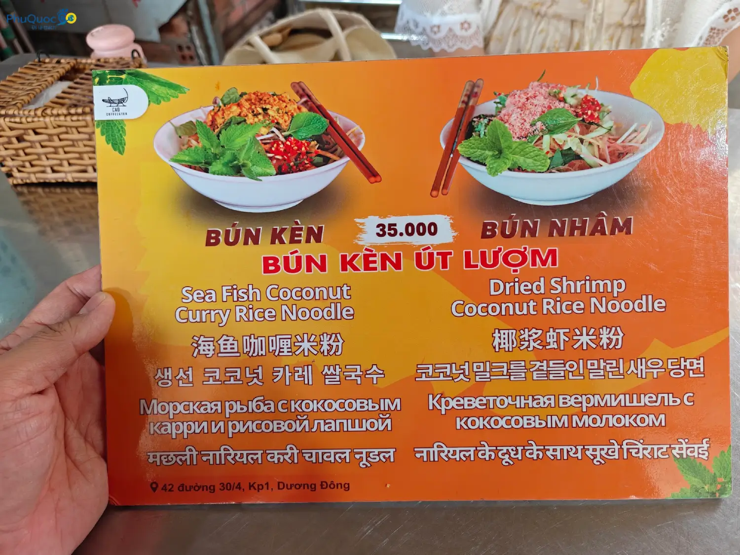 Actual menu at original Ut Luom Bun Ken stall showing address 42 30/4 street, price 35000, and stall logo